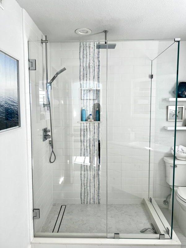 Coastal design
Shower with rainfall tile accent 